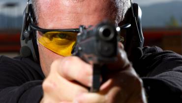 Man at bloomington illinois gun shooting range with protection